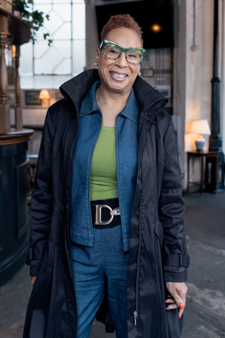 Meave Darroux smiling in front of a London bar