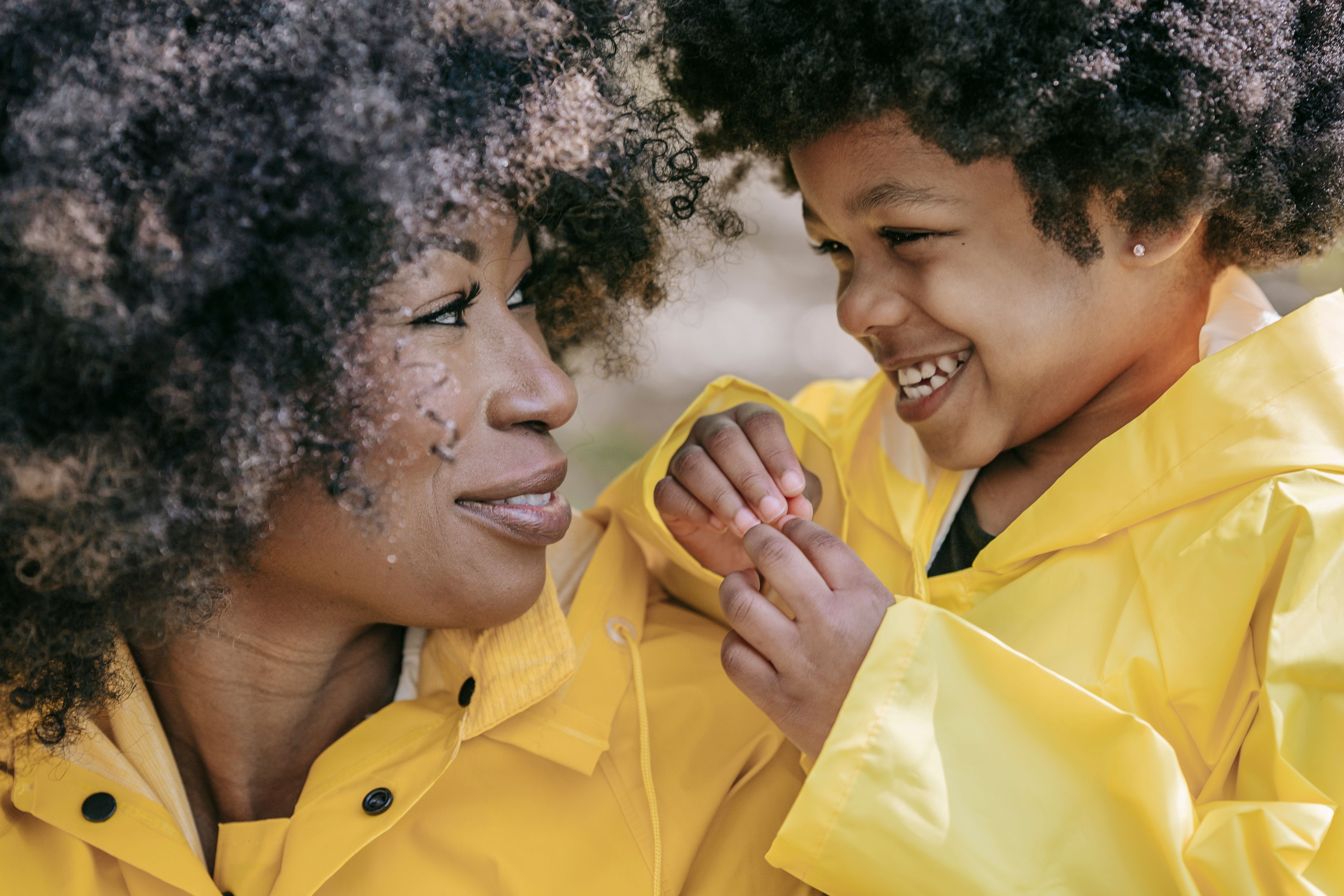 A mother and child smiling warmly